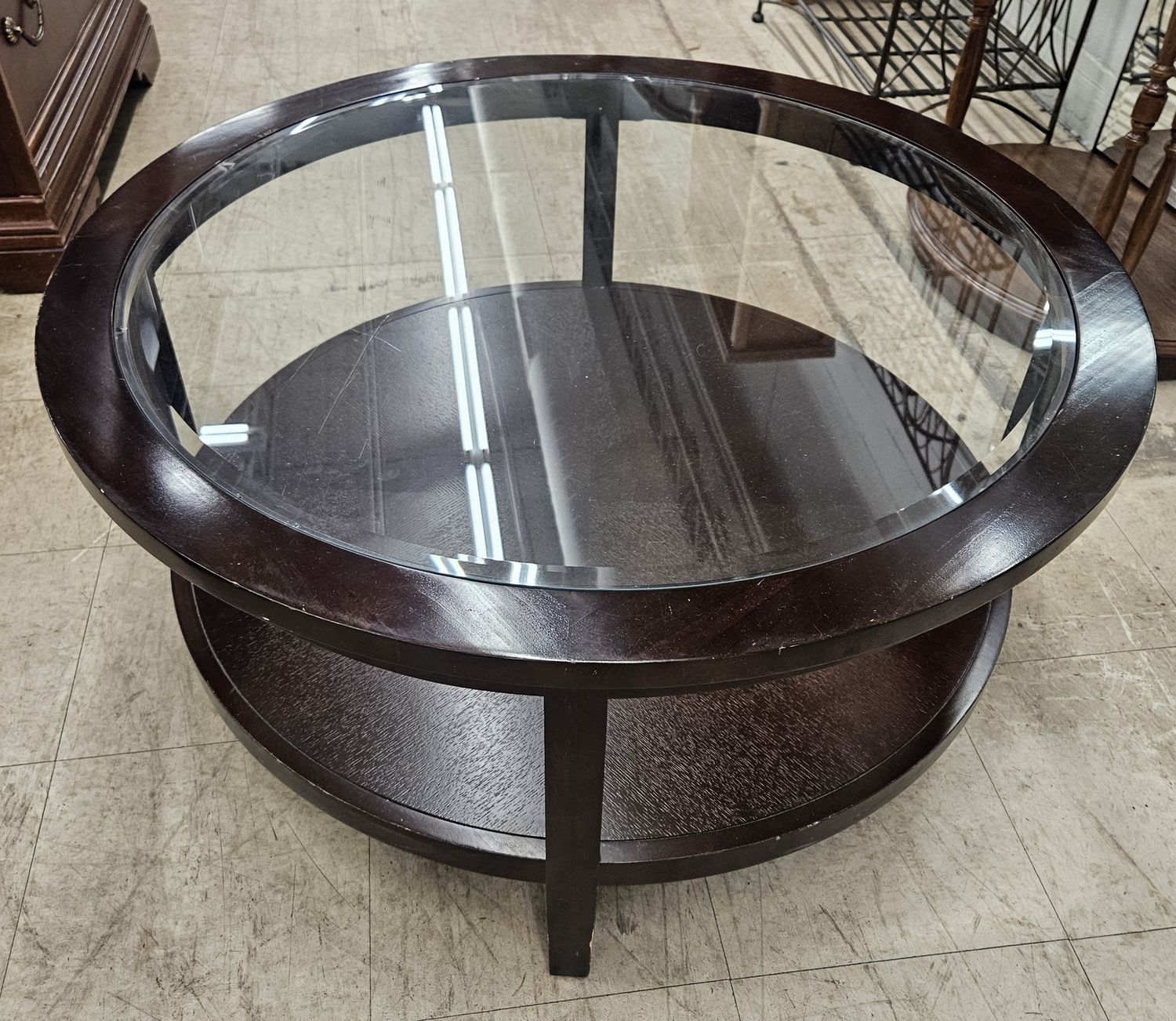 Round glass-top coffee table