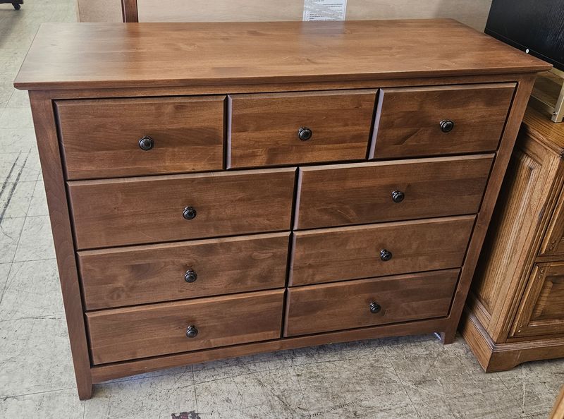 Warm-toned solid wood dresser!