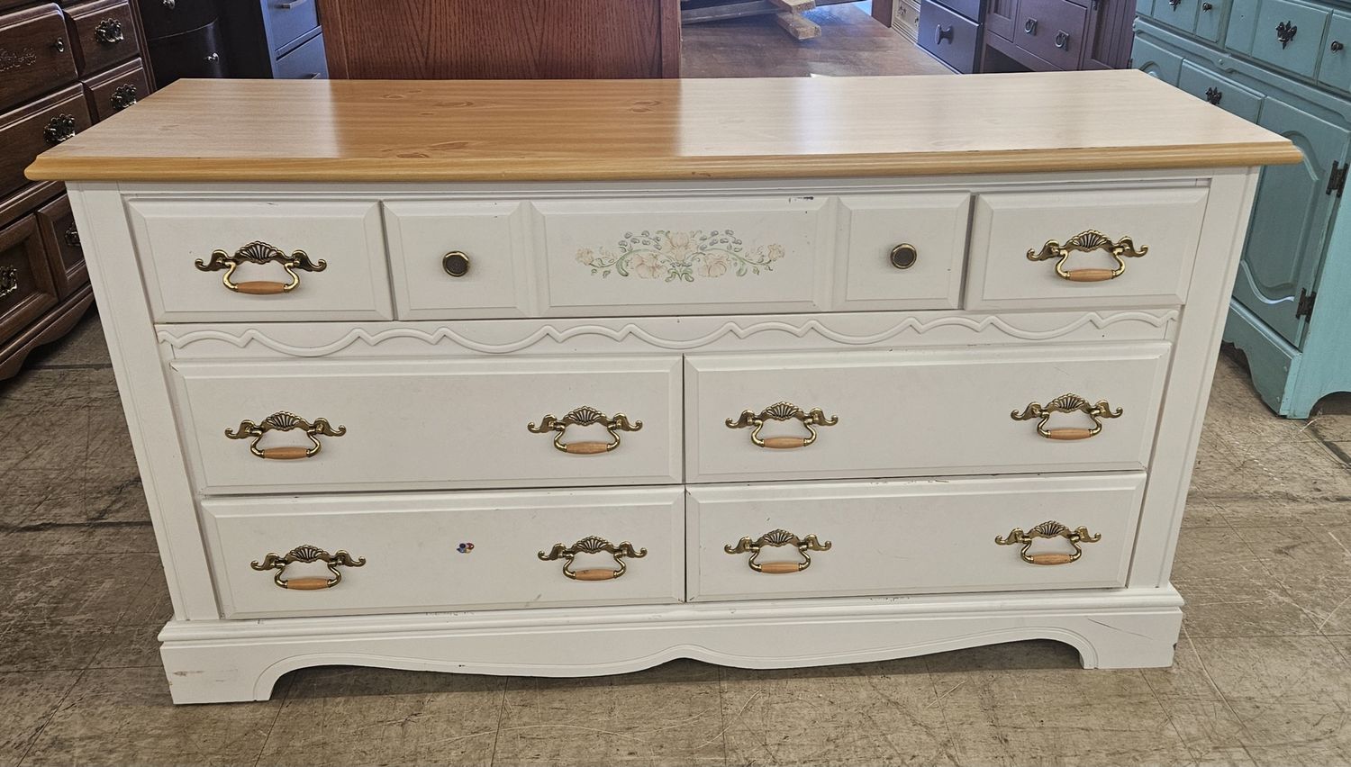 White dresser with a natural wood top