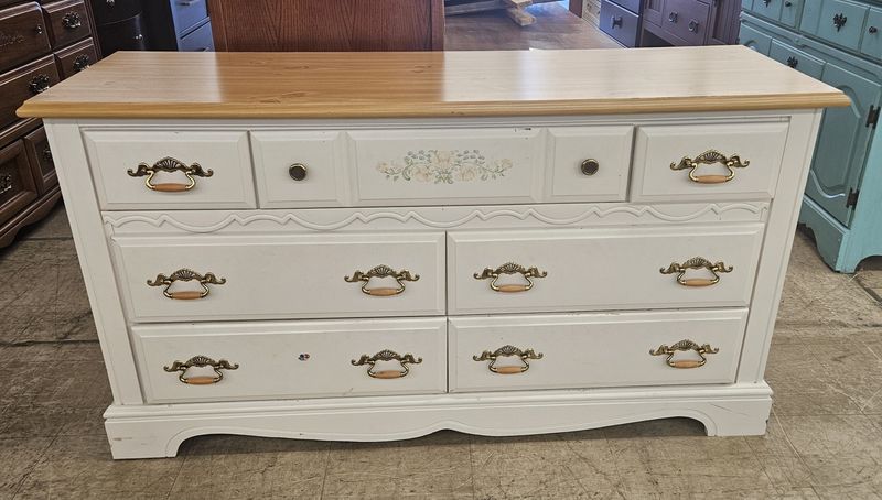 White dresser with a natural wood top