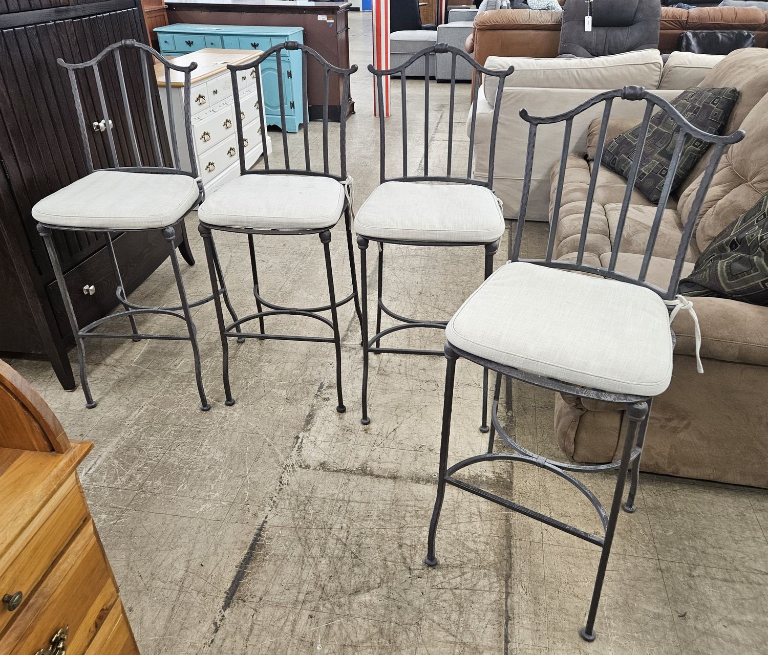Set of four wrought iron barstools