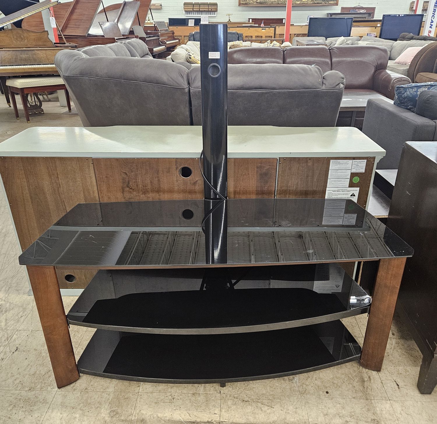 Black glass TV stand with wood accents