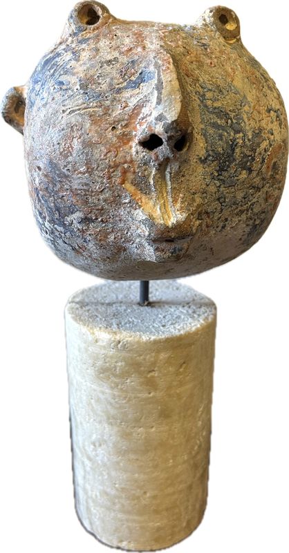 ceramic head on a pedestal