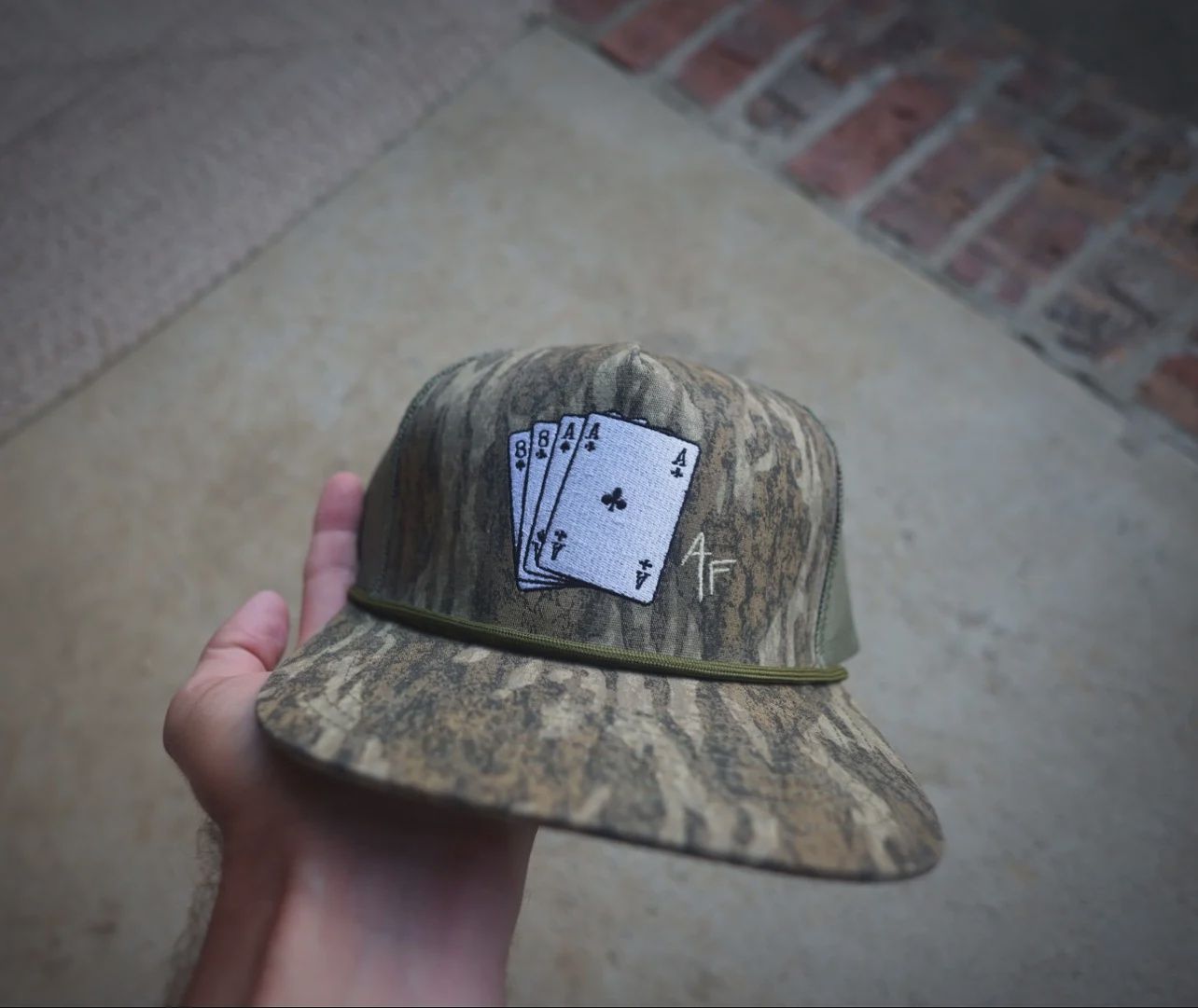 Dead Man’s Hand Rope Trucker Hat - Bottomland Camo