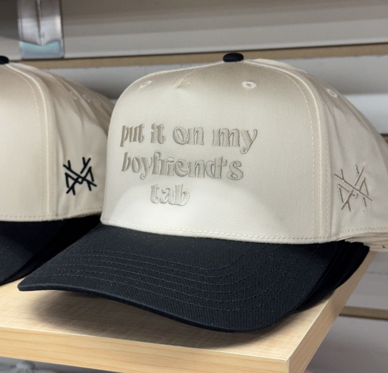 Put It On My Husband's Tab Trucker Hat - Black/ Natural/ Natural