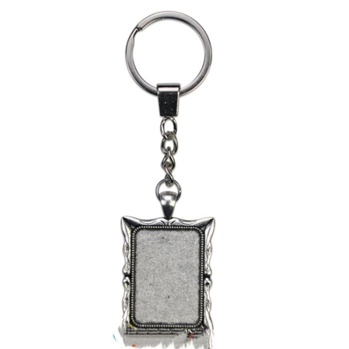 deux  Porte-clés rectangle avec contour en métal argent avec cabochon en verre  PRIX ENTRE : 23.00€ à   16.10 €