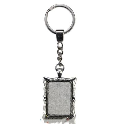 deux  Porte-clés rectangle avec contour en métal argent avec cabochon en verre  PRIX ENTRE : 23.00€ à   16.10 €