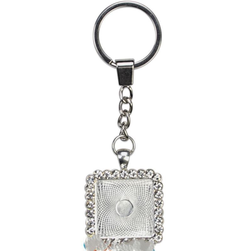 deux   Porte-clés carré en métal argent avec strass blancs et cabochon en verre  PRIX ENTRE   : 21.00€ à 17.70€