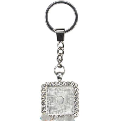 deux   Porte-clés carré en métal argent avec strass blancs et cabochon en verre  PRIX ENTRE   : 21.00€ à 17.70€