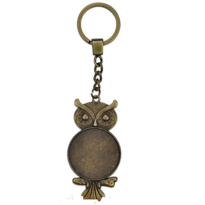 trois Porte-clés Hibou en métal bronze avec cabochon en verre  PRIX  ENTRE :  PRIX ENTRE : 22.00 e à 15.40 e
