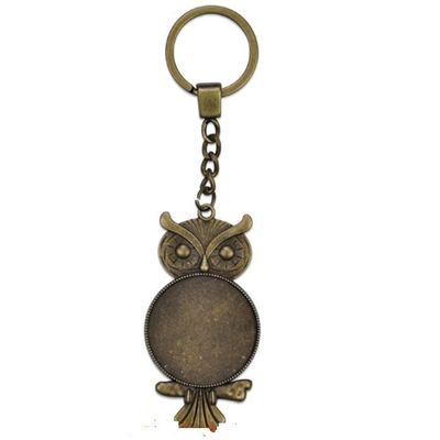 trois Porte-clés Hibou en métal bronze avec cabochon en verre  PRIX  ENTRE :  PRIX ENTRE : 22.00 e à 15.40 e