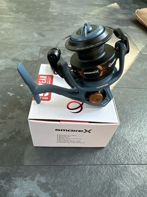 Quantum Smoke X Size 30 Spinning Reel. 6.0:1, 9 Bearings, Great Value For The Cost. 18lb Drag. 220yds 20lb Braid Or 150yds 10lb Mono. NIB