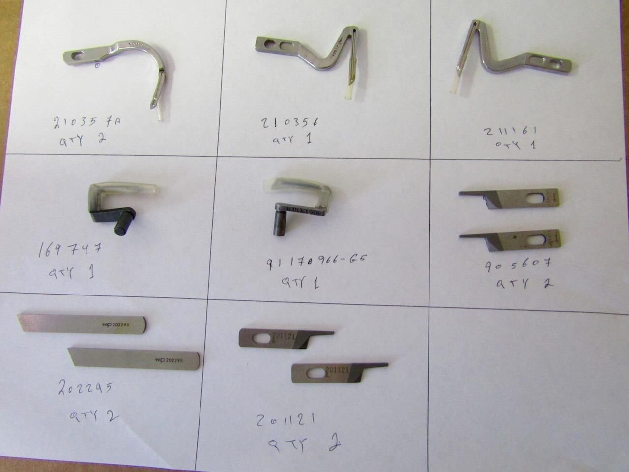 Lot of 11 loopers and attachments for sewing machines