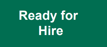 Rectangular green sign with white text with the words Ready for Hire