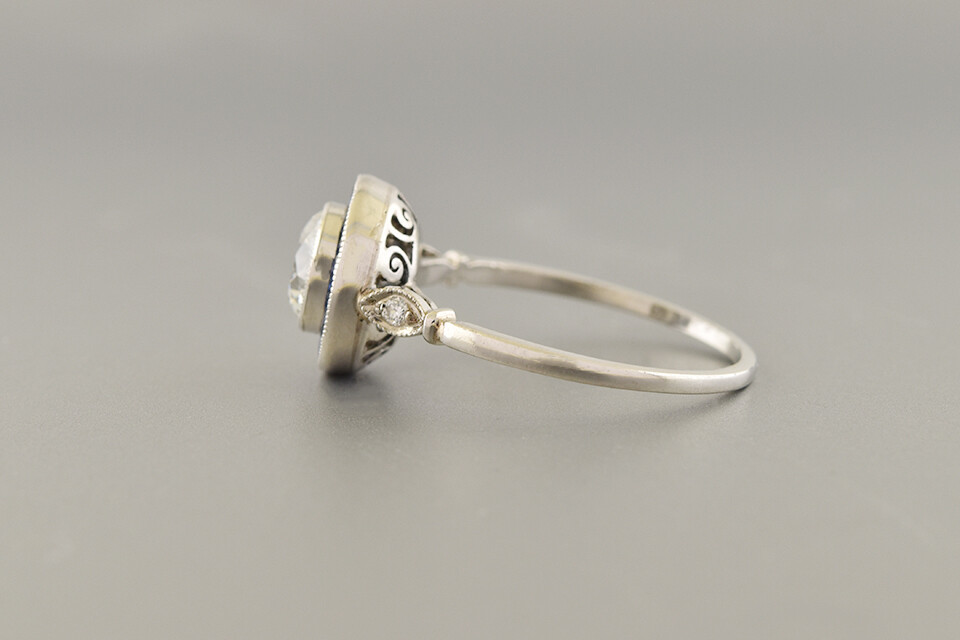 Diamond Ring With Sapphire Halo