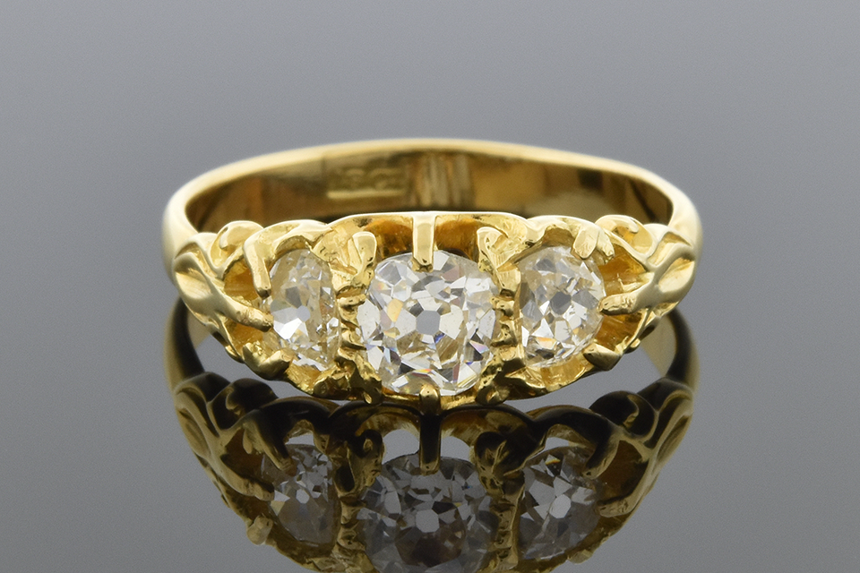 Antique English Three Stone Ring with Old Mine Cut Diamonds