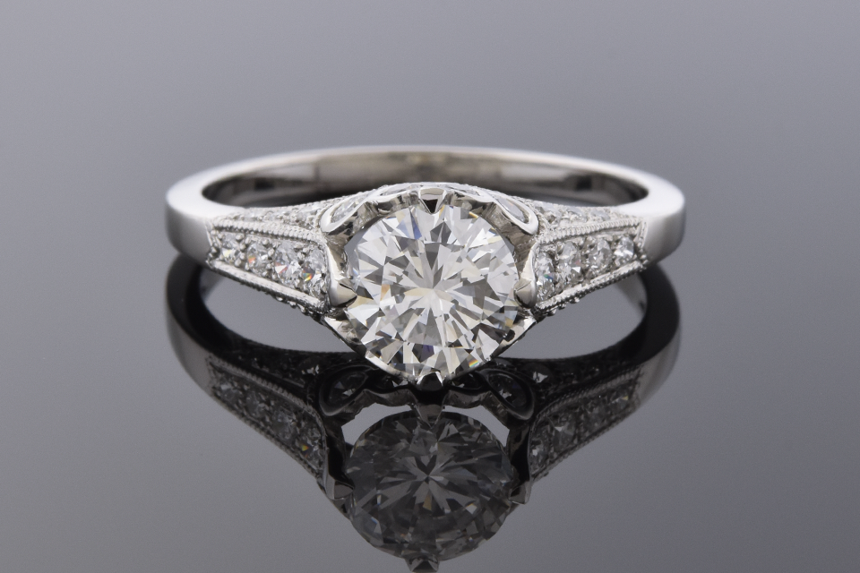 Platinum Ring with Bezel Set Diamond Accents
