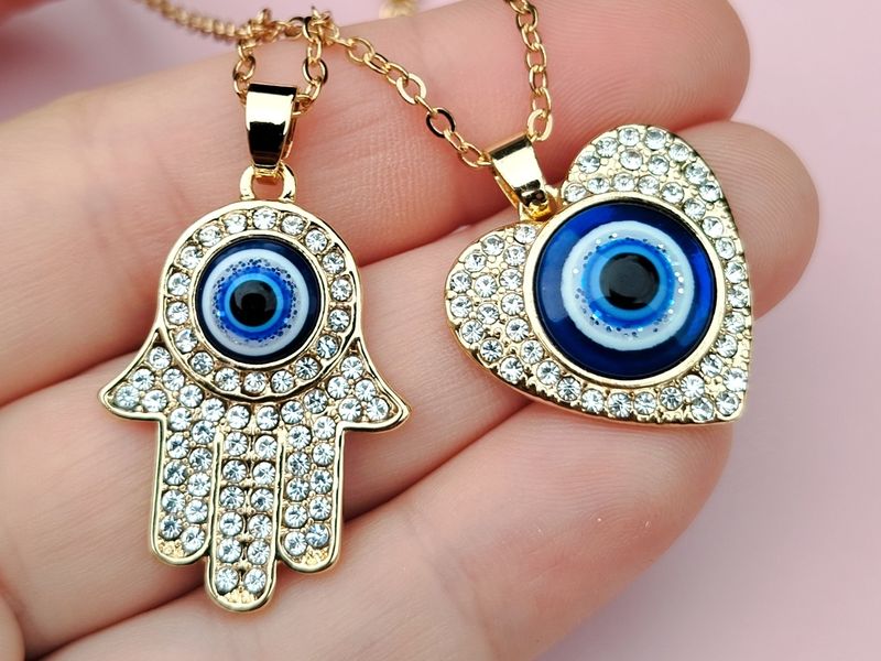 Collar Corazón y Hamsa ojito turco 