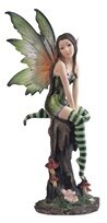 Fairy Green Sitting on Tree Stump