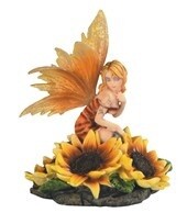 Fairy Sitting in Sunflowers