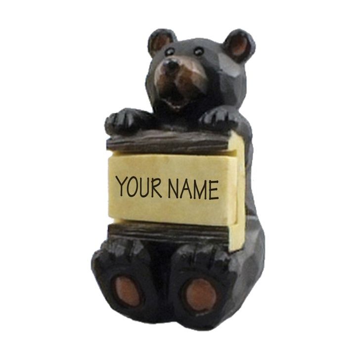 Bear sitting with Sign