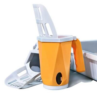 geometrical orange with white litter scoop next to a litterbox