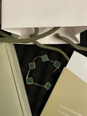 Green clover motif and gold Van cleef &amp; Arpels