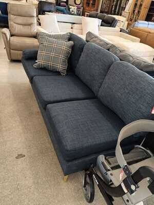 Blue armless 3 seater couch with a fixed pillow