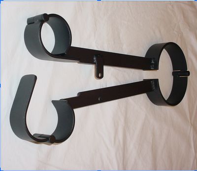 Top-down view of Inquisitor’s Fiddle restraint in black, shown open with collar and wrist sections separated.