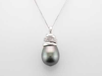 18 carat white gold black pearl and diamond pendant and chain