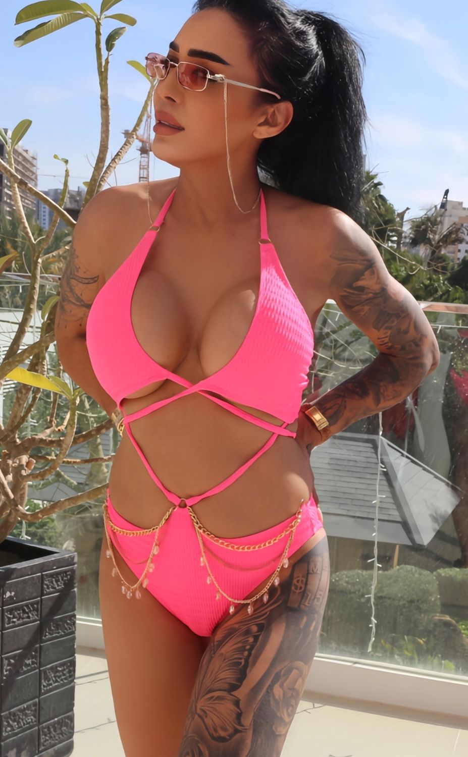 pink swimsuit with gold chain