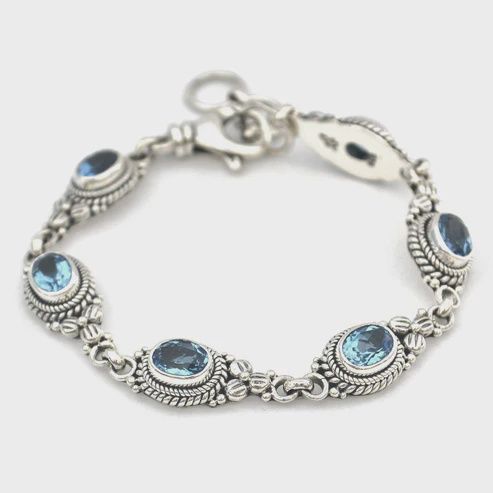 Sterling Silver Bracelet with Faceted Gemstones and Floral Design