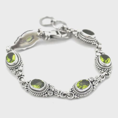 Sterling Silver Bracelet with Faceted Gemstones and Floral Design, Attribute: Peridot