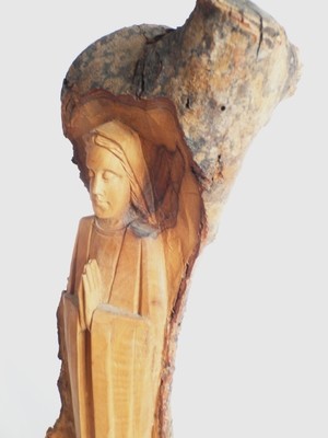 Beautifully carved Saint and rough wood on the back 