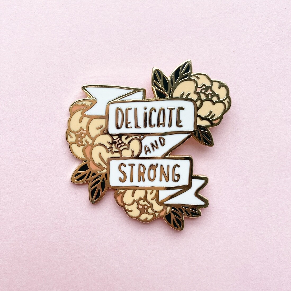Delicate & Strong in gold pin