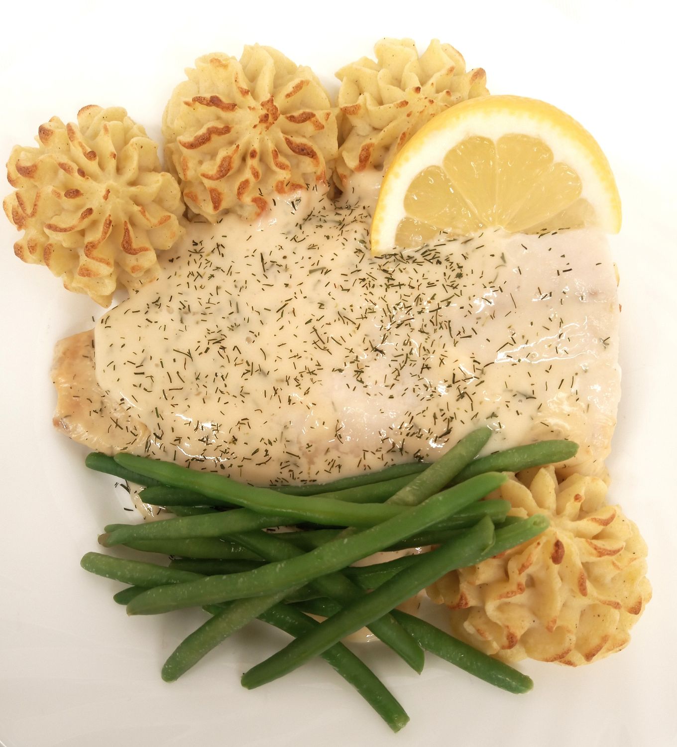 Ugnsbakad sej med dusespotatis och citronsås