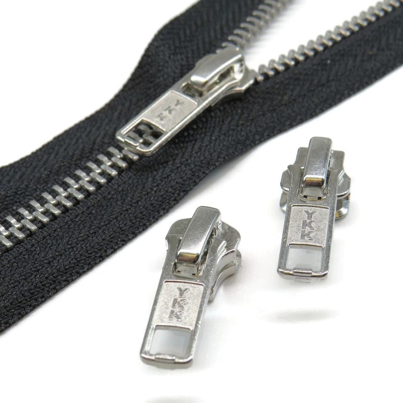 YKK metal zip sliders.  YKK runners for size 5 metal zips,  Silver zip pullers ideal for coat, jacket and bag repairs.