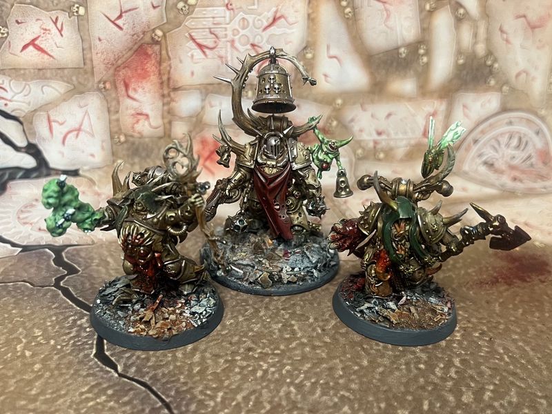 Death Guard: Malignant Plaguecaster, Noxious Blightbringer, and Plague Marine Champion