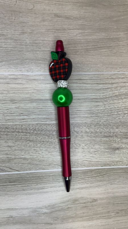 Red pen with Apple focal