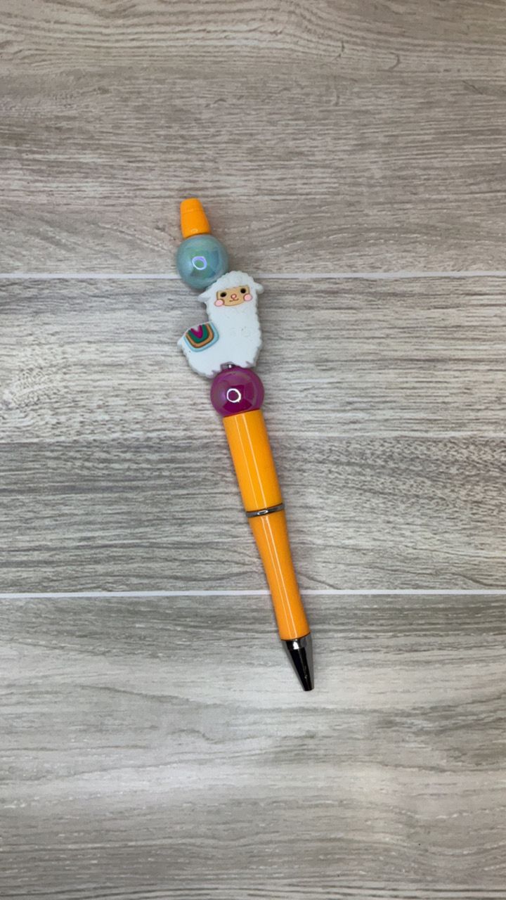 Orange pen with Llama focal
