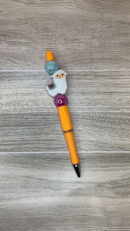 Orange pen with Llama focal