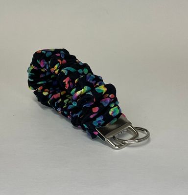 Black with tie dye dog bones and paws