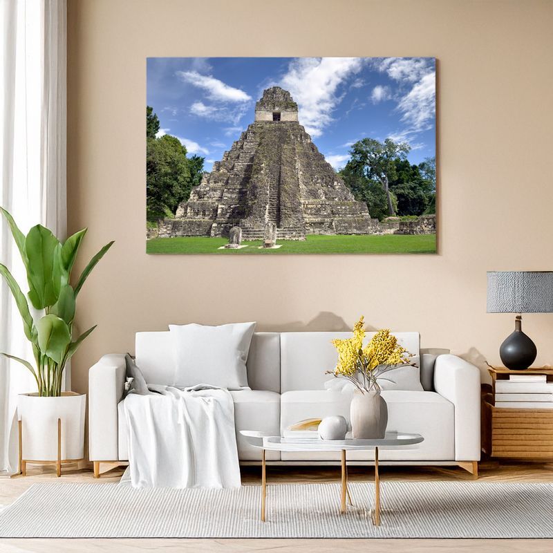 Canvas print of Tikal pyramid close-up with bright blue sky adding history to modern decor