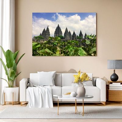 Canvas print of Prambanan temple complex with lush green foreground for living room art