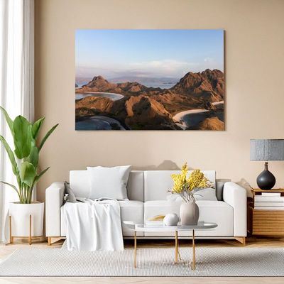 Canvas print of Komodo landscape with rugged hills and bays in morning light for modern decor
