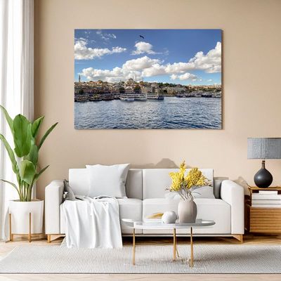 Wall art in a living room showing the view across the water to Istanbul’s old city with mosques, boats, and a blue sky with s