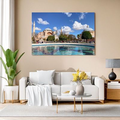 Istanbul - Hagia Sophia Daytime Splendor Wall art above a bright sofa featuring a daytime photo of Hagia Sophia in Istanbul with a large fountain in the foreground an