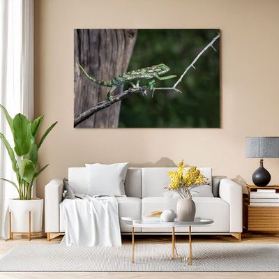 Flap-necked Chameleon – The Silent Traveler A stylish living room with a large wall art print of a Flap-necked Chameleon on a branch.