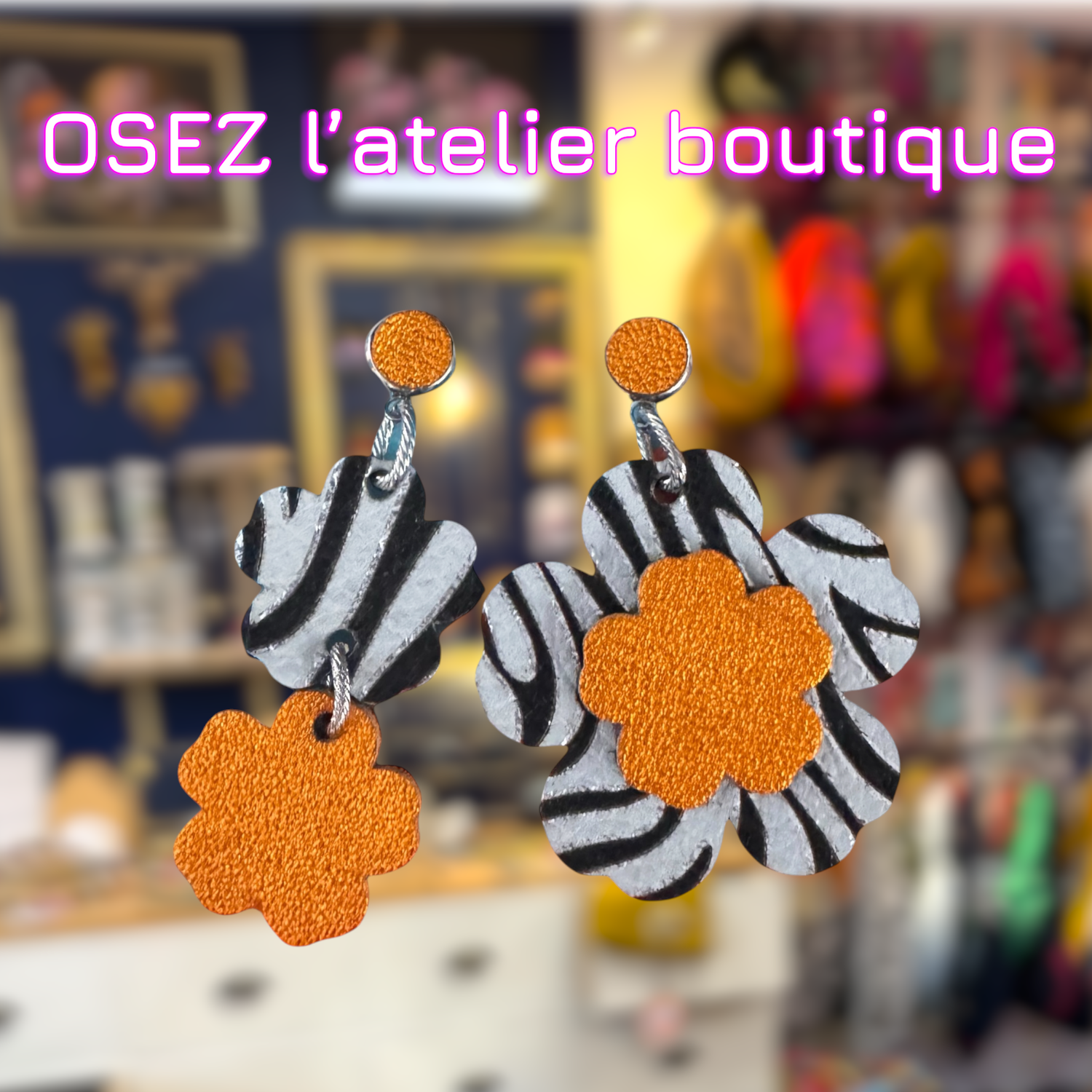 Boucles d’oreilles fleurs "pas pareilles" en cuir, noires, blanches et oranges