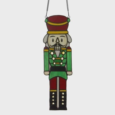 Nutcracker stained glass window panel on white background showing full design
